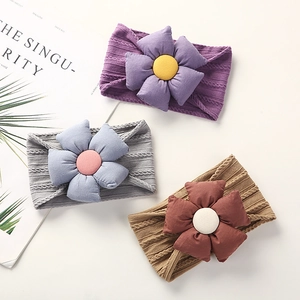 Set of 3 nylon flower baby headbands in purple, grey, and brown with jacquard patterns