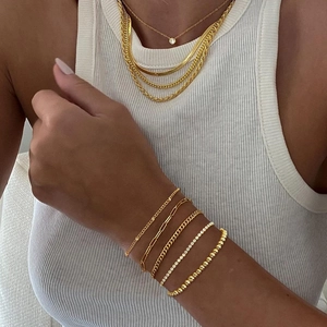 Close-up of gold-plated titanium steel chain set with snake and paperclip link designs