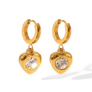 Macro shot of gold 18K stainless steel heart earrings with sparkling zircon crystals