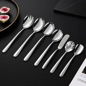 Elegant 304 stainless steel cutlery set with assorted spoons and steak knife on dark table
