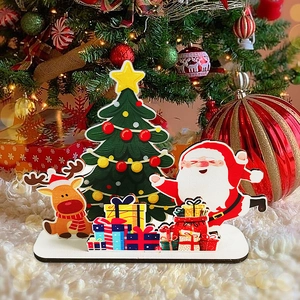Wooden Santa Claus and reindeer Christmas tabletop ornaments on a plush white rug