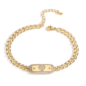 Golden Cuban chain bracelet with heart and star zircon charms on white background