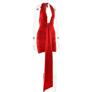 Detail of red halter mini dress featuring deep V-neck, ruched sides and long drape ribbon