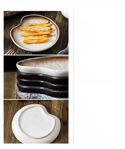 Close-up of thick ceramic snack plates with non-slip unglazed bottom and wavy edges