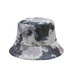 Reversible bucket hat with abstract graffiti print for outdoor sun protection and leisure