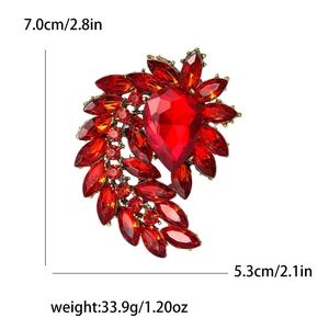 Vintage red rhinestone brooch for women with radial crystal design on antique gold base