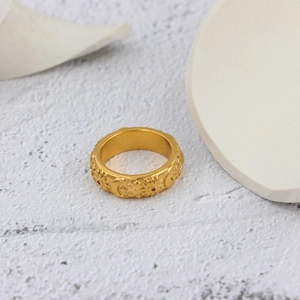 Vintage stainless steel moon and star embossed gold ring with red zircon accents