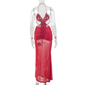 Detail of red halter backless dress featuring cross drawstring waist and mesh maxi skirt