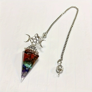 Macro detail of hexagonal resin pendant with 7 chakra crystals and pentagram charm