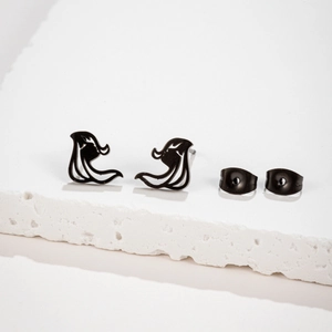 Minimalist abstract black metal stud earrings for women on white textured stone background