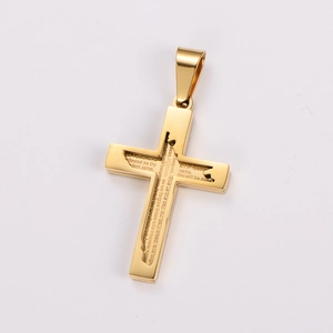 Macro shot of gold stainless steel cross pendant featuring engraved Lord's Prayer text