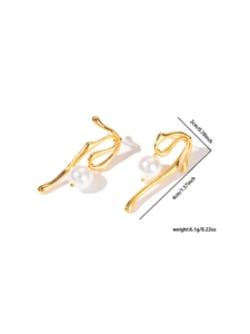 Detail view of gold wavy metal earrings with white pearls and size measurements