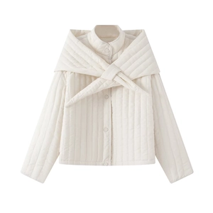 Detailed view of white quilted jacket with a stylish detachable matching tie-knot collar