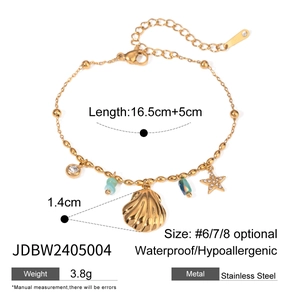 Detail of 18K gold stainless steel bracelet with seashell, starfish and colorful beads