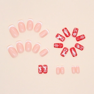 Christmas press-on nails set with red festive reindeer, snowflakes and French tip designs
