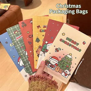 Cartoon Christmas themed paper gift bags featuring festive patterns and Merry Christmas text