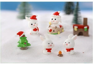 Miniature resin Christmas scene with cute rabbits, reindeer sled, and tiny festive tree