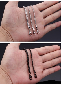 Detail of silver and black stainless steel twisted rope chains with lobster clasps