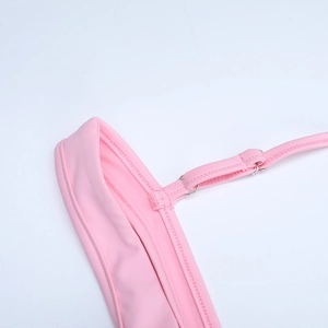 Close-up of pink backless dress adjustable straps and fine stitching details