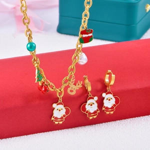 Festive Christmas jewelry set with Santa and reindeer charms on gold necklace and earrings