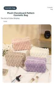Detailed view of four colorful plush checkerboard cosmetic bags with zipper closure