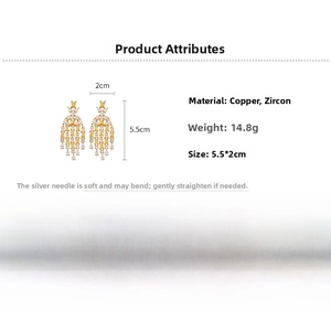 Detail of gold zircon tassel earrings showing precise 5.5cm height and 14.8g weight specs