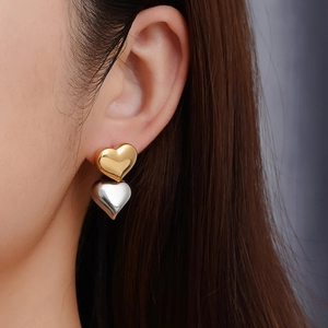 Boucles d'oreilles double cœur poli en contraste or et argent pour femmes chic