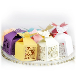 Laser-cut butterfly favor boxes in multiple colors for wedding candies and small gifts