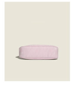 Detail shot of the pleated pink underarm bag base showing high-quality soft texture