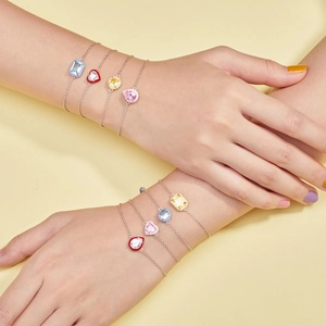 Detail of four S925 silver bracelets with colorful enamel stones and zircons