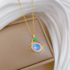 Luxurious gold crab pendant necklace with gradient gemstone and crystal accents