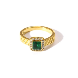 Detailed close-up of an 18K gold plated double layer ring with a square green zircon stone