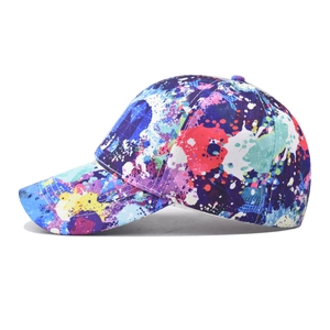 Colorful graffiti baseball cap with artistic paint splatter design and curved brim style