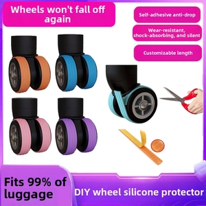 Detail showing the DIY silicone luggage wheel covers being cut to size with scissors