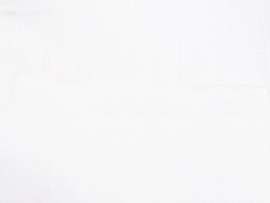 Macro shot of white trench coat fabric showing detailed breathable linen-like texture