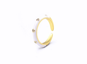 Close-up of 18K gold plated ring featuring white enamel finish and inset zircon stones