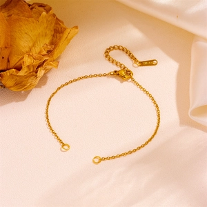 Close-up of 18k gold plated stainless steel bracelet with lobster clasp and S.STEEL tag