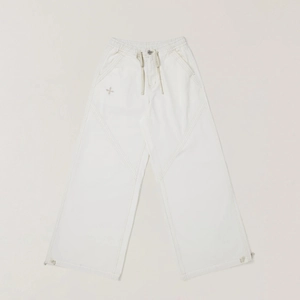 Detailed view of beige cargo pants with elastic drawstring waist and cross embroidery