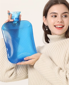 Detailed view of a blue translucent hot water bottle with anti-slip diagonal texture