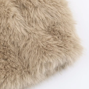 Close-up of soft light brown faux fur texture showing fine plush fibers on a short jacket