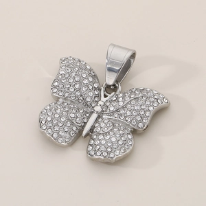 Detailed close-up of a sparkling silver butterfly pendant with micro-pave crystals