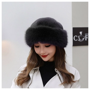 Detailed close-up of a plush dark purple faux fur beret hat for winter warmth