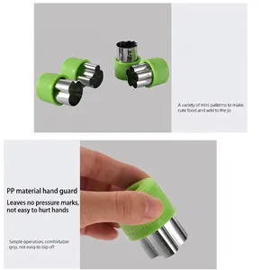 12-piece stainless steel cookie and vegetable cutter set with green ergonomic hand guards