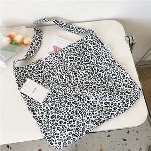 Large leopard print canvas tote bag for women featuring a minimalist black and white design