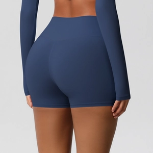 Detail view of high-waisted navy blue yoga shorts with lift effect and brushed fabric