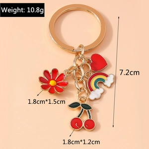 Detailed view of multi-charm keychain with dimensions for cherry and flower pendants