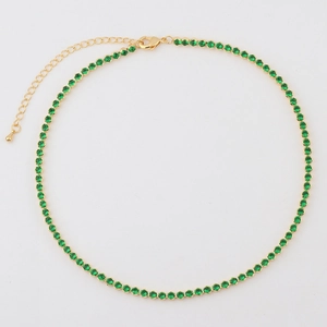 Detail of green round-cut zircon tennis necklace with gold plating and lobster clasp