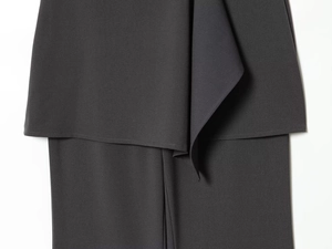 Detail of black double-layered suit fabric with fine texture and structured tailoring