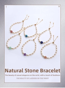 Detail view of handmade natural stone bracelets with freshwater pearls and adjustable chains