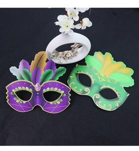 Detail of colorful paper masquerade masks with printed feathers and purple gemstones